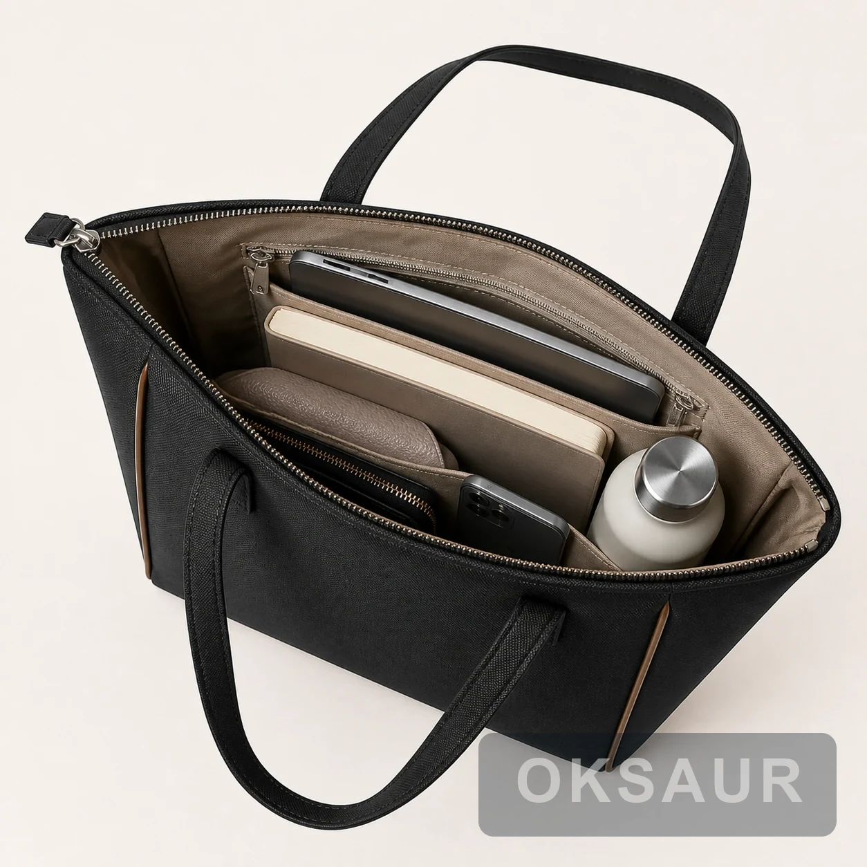 Open interior of a black structured tote with tablet, notebook, and organizer pockets