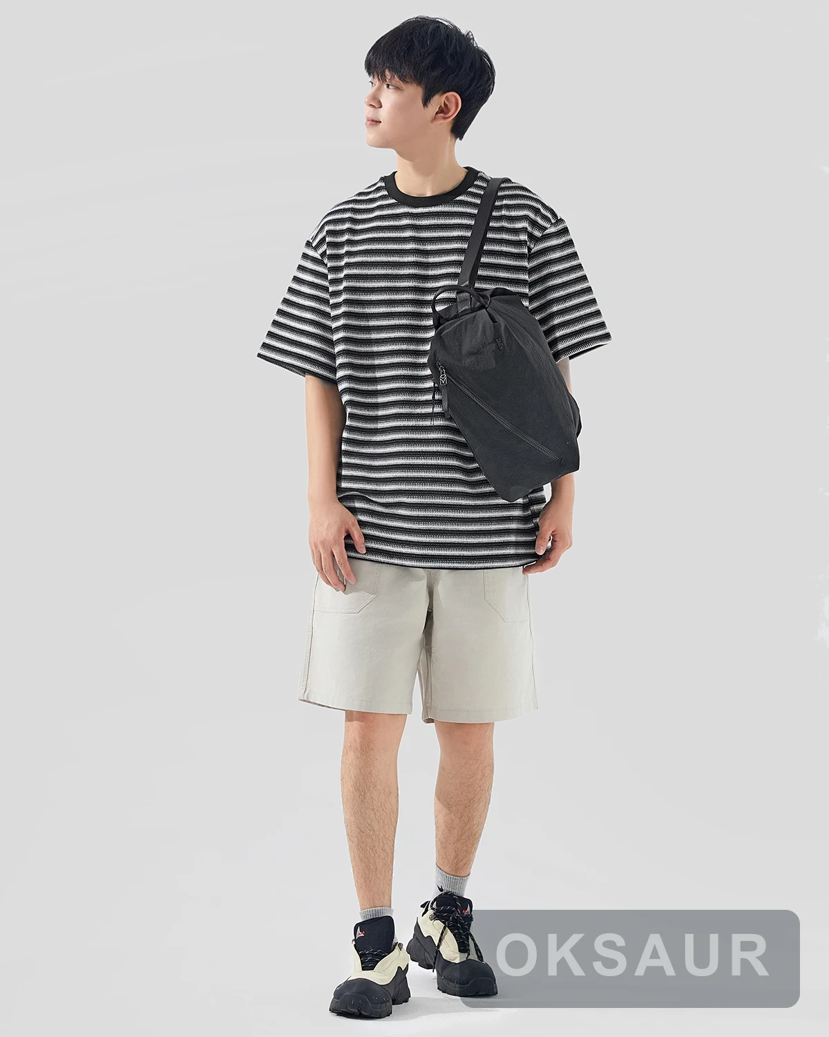 Black square sports bag carried by hand