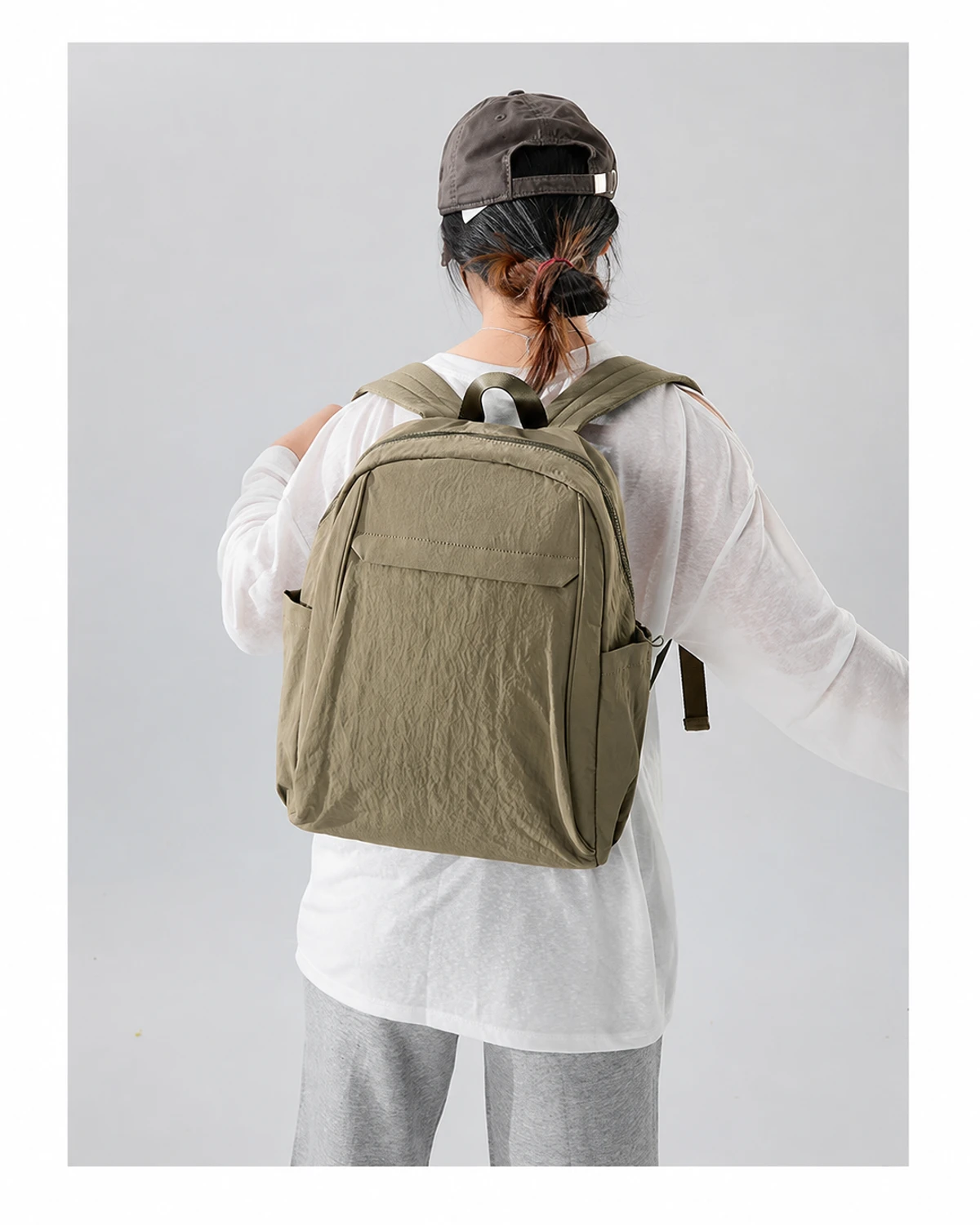 Large-capacity backpack worn on a model in a clean studio setting